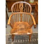 A 19th century ash and elm Windsor chair with crinoline stretcher