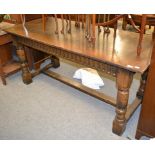 A Titchmarsh & Goodwin style oak refectory table with trestle base, 168cm by 71cm by 76cm