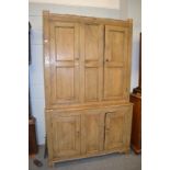 A pine farm house kitchen cupboard, 131cm by 62cm by 217cm