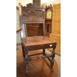 A late 17th century geometric moulded plank seated chair