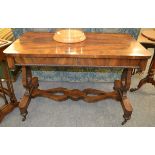 An early 19th century rosewood library table lyre ends, shaped stretcher, turned supports to