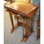 Four Edwardian walnut nesting tables, the largest 56cm by 43cm by 73cm