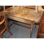 An early 19th century farmhouse kitchen table with scrubbed top, 125cm by 63cm by 72cm