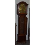 An oak eight day longcase clock, arch brass dial Thos Radford, Leeds, strike/silent selection in the