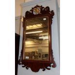 A George III fret work mirror, surmounted by a Ho Ho bird, with gilt slip