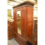 A Victorian mahogany single door wardrobe