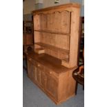 A pine farm house dresser, 153cm by 54cm by 200cm