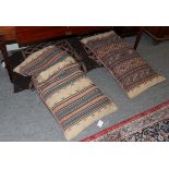 A pair of Kurdish saddle bags, each with a polychrome diamond lattice field enclosed by narrow