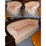 An early 20th century Chesterfield three-piece suite upholstered in buttoned fabric, comprising a