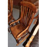 An early 19th century oak rocking chair
