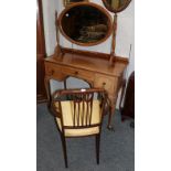 A 1930s walnut dressing table, an oval bevelled glass dressing table mirror and an Edwardian