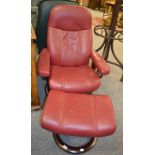 An Ekornes bentwood red upholstered Stressless recliner with footstool