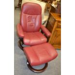 An Ekornes bentwood red upholstered Stressless recliner with foot stool