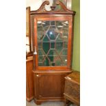 A 19th century mahogany floor standing glazed corner cupboard and an early 19th century