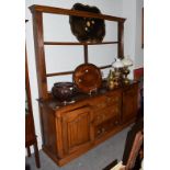 An oak Cumberland dresser with plate rack, 184cm by 48cm by 196cm