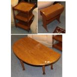 A reproduction oak drop leaf coffee table on pad feet, another oak drop leaf coffee table, a