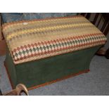 A modern upholstered Ottoman of waisted rectangular form, 102cm by 49cm by 60cm