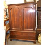 An 18th century oak press cupboard with dentil corners, the interior with three sliding trays, 128cm