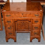 A reproduction inlaid burr walnut kneehole desk, 76cm by 48cm by 76cm