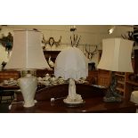 Three various table lamps including one with dolphin form base