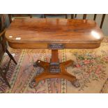 An early Victorian mahogany fold over card table