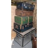 Five assorted trunks/cases, the largest labeled ''Mossman''