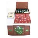 A Quantity of Rhodesian Cap and Collar Badges, in a teak case,