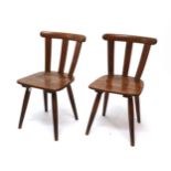A Pair of German Third Reich Kreigsmarine Chairs, in beech, with curved cresting rails,