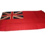 A British Merchant Navy Red Ensign, in stitched panels of linen, the hoist stencilled 4YD ENSIGN,