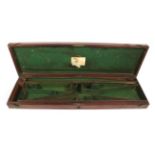 A 19th Century Brass Bound Mahogany Shotgun Case, the hinged cover with inset brass ring handle,
