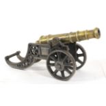 A Victorian Brass Signal Cannon, the 26cm triple ringed barrel with globular cascabel,