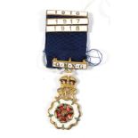 A First World War Queen Mary's Needlework Guild Gilt Metal and Enamel Breast Badge,