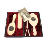 A Copy of a German Third Reich SS Ivorine Vanity Set, comprising a hair brush and hand mirror,
