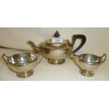 Three piece bachelor's silver tea set in the Art Nouveau style. Hallmarked for Birmingham 1920.