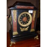 Victorian marble mantle clock by Maple & Co with ormolu mounts and black dial and gilt Roman