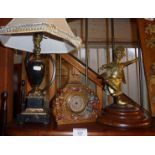 Ormolu and marble table lamp, an Oriental brass dancing man and a German kitsch metal clock