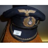 German 'U'-Boat Captain's peaked cap with three badges attached