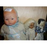 Armand Marseille bisque headed baby doll, and two others, a wooden peg type doll, and a very