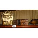 Bronze piggy bank, a brass faced tin 'Bank' money box and two tin money boxes in the form of