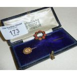 15ct gold diamond stickpin in its original Harrod's case and a small pin set with coral