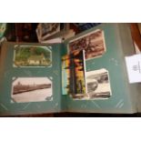 Postcard album of over 140 assorted cards