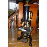 A microscope by Watson & Glover of Birmingham with fitted mahogany case and original instruction