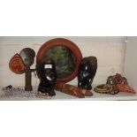 Two carved wood African heads, some beadwork, pair of Aborigine clapping sticks, etc