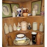 Four shelves of assorted pottery, stoneware and pictures