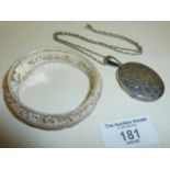 Silver coloured metal filigree bracelet (marked TORRES), and a large engraved silver? locket on