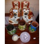 Four antique Staffordshire spaniels, some Torquay pottery with Cockington Forge motto, and a