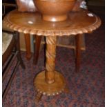 Walnut occasional table on turned and carved centre column