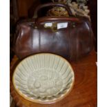 Vintage leather doctor's Gladstone bag, and a stoneware jelly mould with Prince of Wales feather