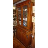 Victorian mahogany bookcase with glazed upper section above single drawer and two cupboard doors