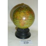 Treen Anchor sewing cotton reel holder in the form of a globe, with hole to top for thread, c. 1900